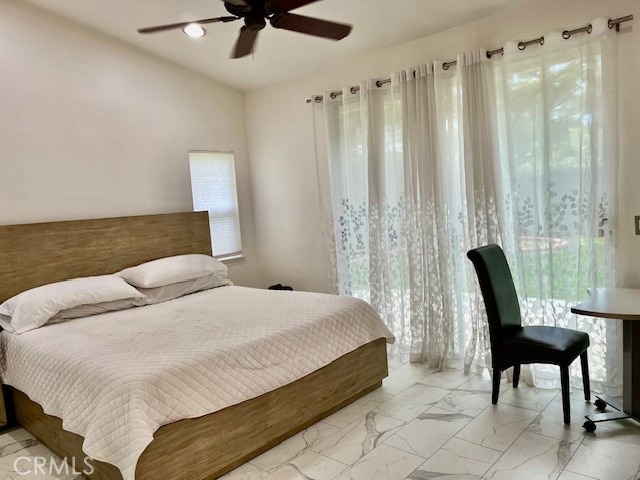 bedroom featuring ceiling fan