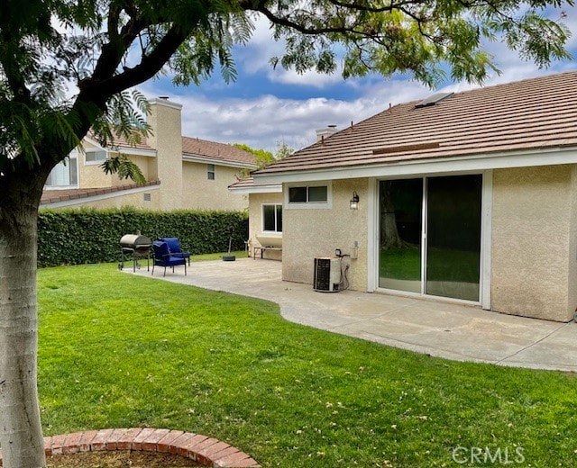 view of yard with a patio and cooling unit