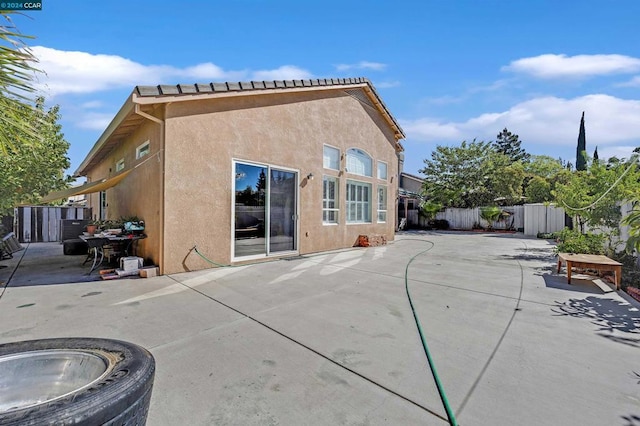 back of house featuring a patio area