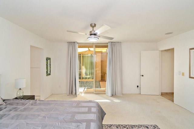 unfurnished bedroom with ceiling fan, access to exterior, and light carpet