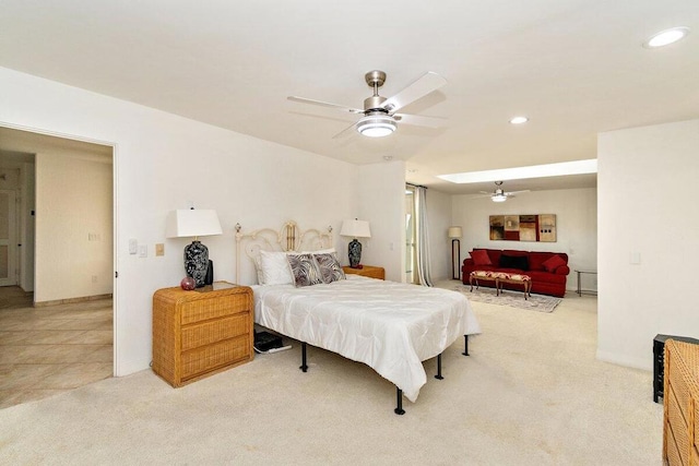 bedroom featuring ceiling fan and light carpet