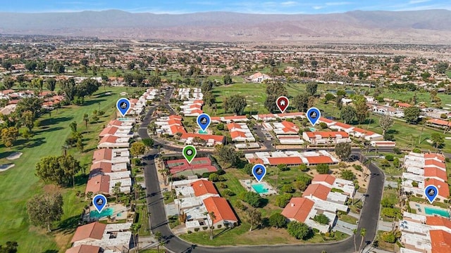 birds eye view of property with a mountain view