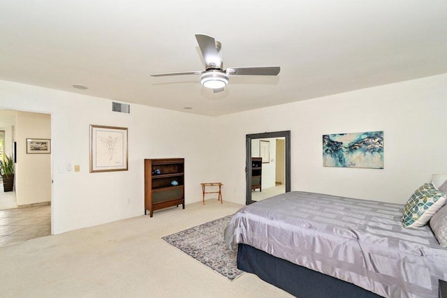 bedroom featuring ceiling fan and light colored carpet