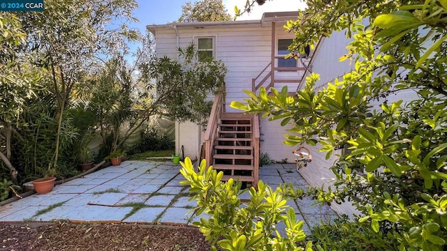 rear view of property featuring a patio area