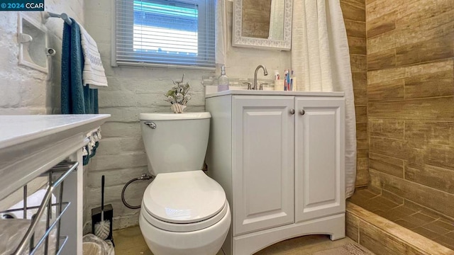 bathroom featuring walk in shower, vanity, and toilet