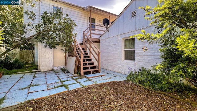 rear view of house featuring a patio