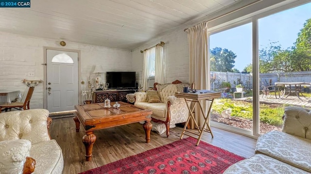 living room with wooden ceiling and hardwood / wood-style floors