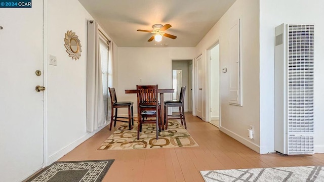 dining space featuring ceiling fan and light hardwood / wood-style floors