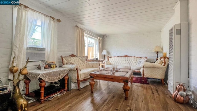 living area with hardwood / wood-style flooring and plenty of natural light