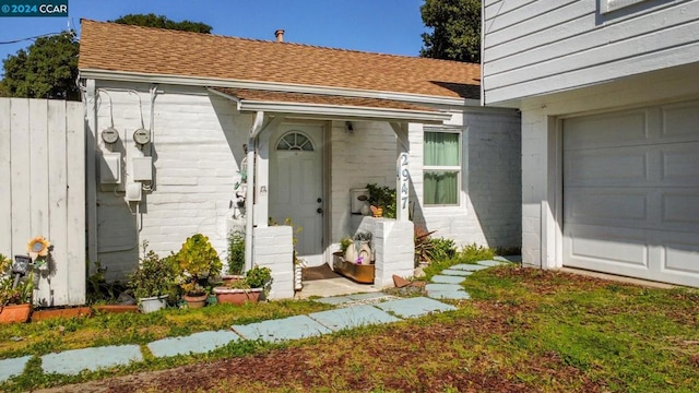 entrance to property featuring a garage