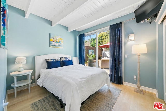 bedroom featuring wood ceiling, beam ceiling, and light hardwood / wood-style floors