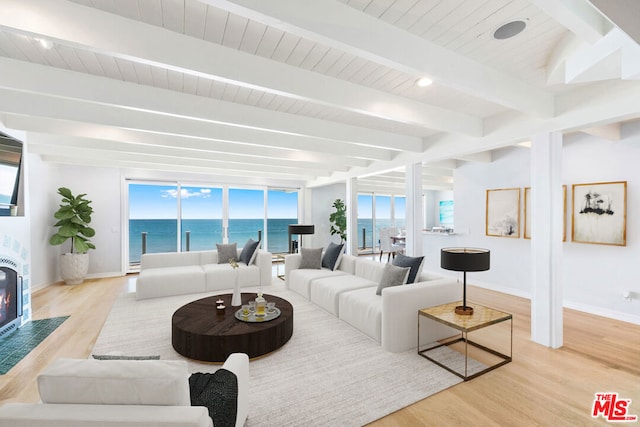 living room with light hardwood / wood-style flooring, beam ceiling, and wood ceiling