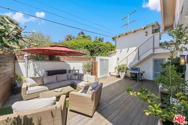 deck featuring a grill and outdoor lounge area