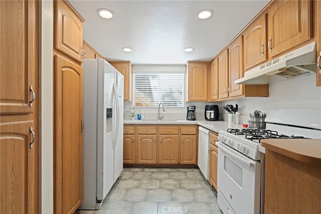 kitchen featuring sink and white appliances