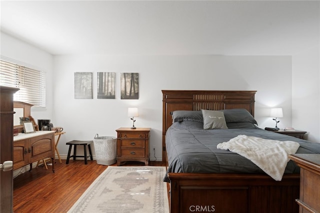 bedroom with hardwood / wood-style flooring