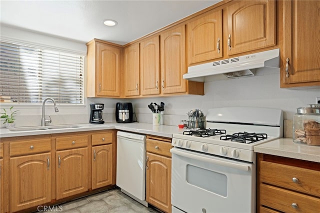 kitchen featuring white appliances and sink