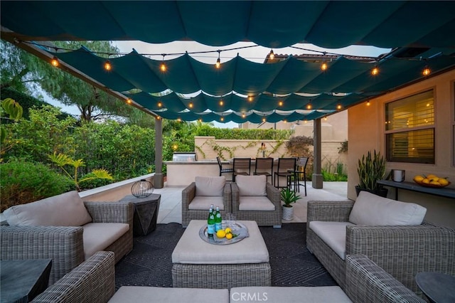 view of patio / terrace with outdoor lounge area and a bar