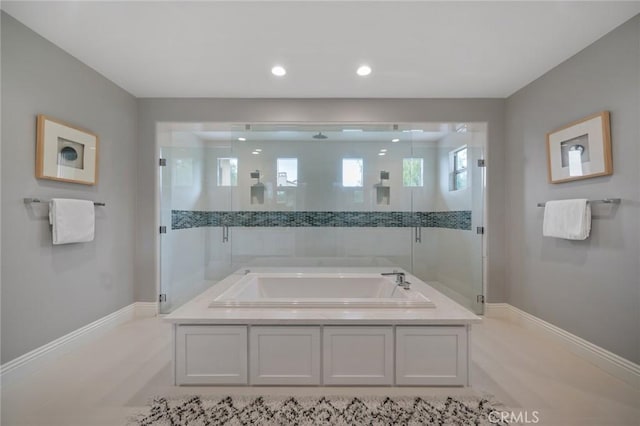 bathroom featuring tile patterned floors and plus walk in shower