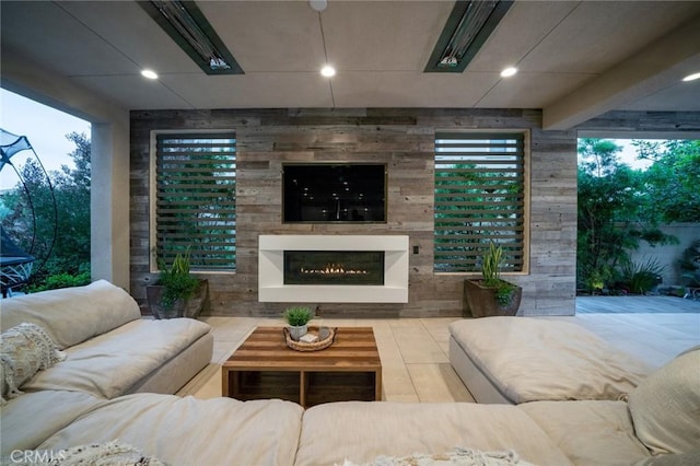 view of patio / terrace with an outdoor living space with a fireplace