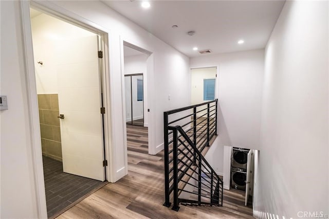 corridor with hardwood / wood-style flooring