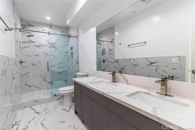 bathroom with toilet, vanity, tile walls, and tiled shower