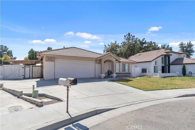 single story home featuring a garage and a front yard