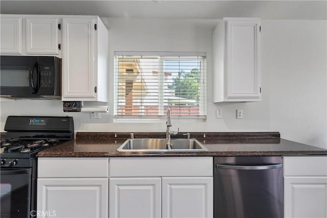 kitchen featuring black appliances, white cabinets, and sink