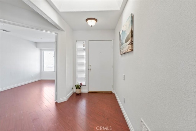 foyer entrance featuring dark hardwood / wood-style flooring