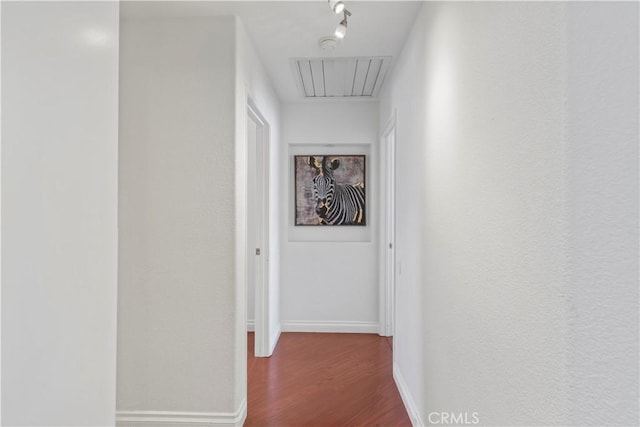 hallway featuring wood-type flooring