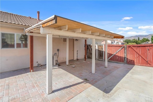 view of patio / terrace with a mountain view