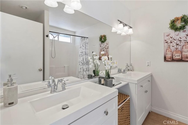 bathroom with tile patterned floors, vanity, and walk in shower