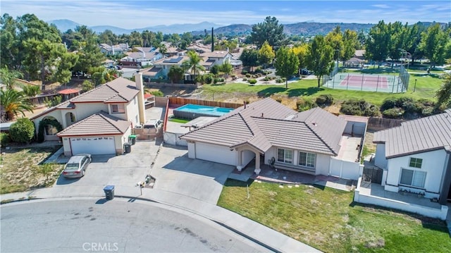 birds eye view of property with a mountain view