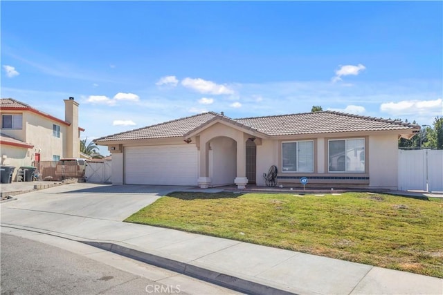 view of front of property with a garage and a front lawn