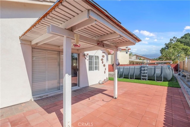 view of patio / terrace featuring a fenced in pool