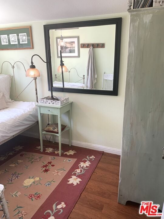 unfurnished bedroom featuring dark hardwood / wood-style flooring