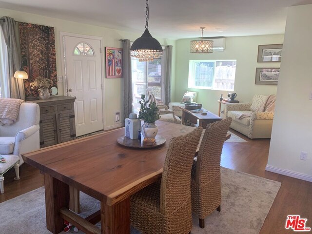 dining area with hardwood / wood-style flooring