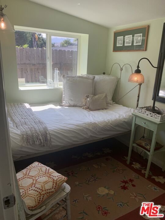 bedroom featuring vaulted ceiling