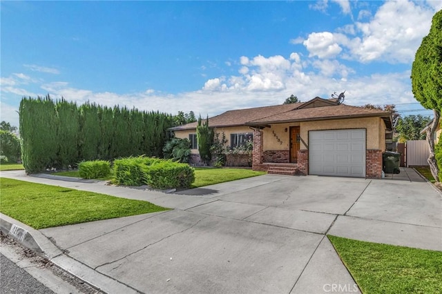 view of front of property with a garage and a front lawn