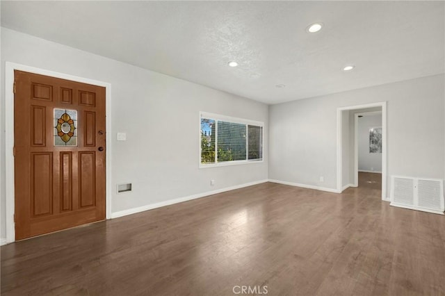 entryway with dark hardwood / wood-style floors