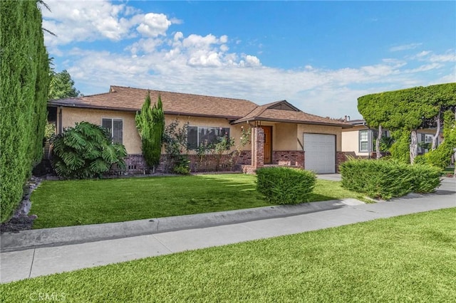 single story home featuring a garage and a front yard