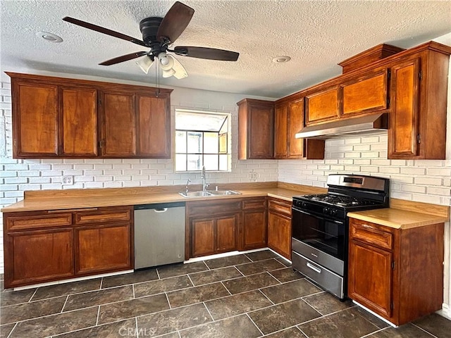 kitchen with wood counters, dishwasher, sink, and range with gas cooktop