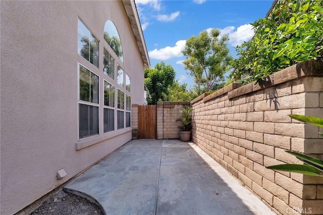 view of side of home featuring a patio area