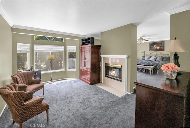 carpeted living room with a tile fireplace and crown molding