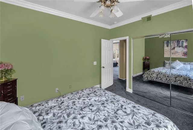 carpeted bedroom featuring a closet, ceiling fan, and crown molding