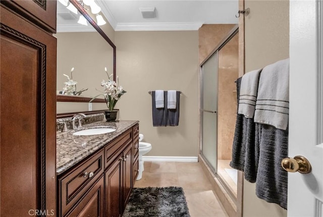 bathroom featuring vanity, toilet, a shower with shower door, and crown molding