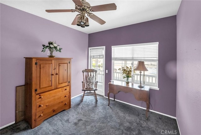 sitting room with carpet flooring and ceiling fan