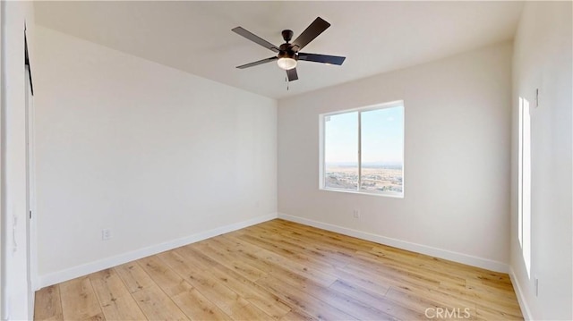 unfurnished room featuring light wood-type flooring and ceiling fan