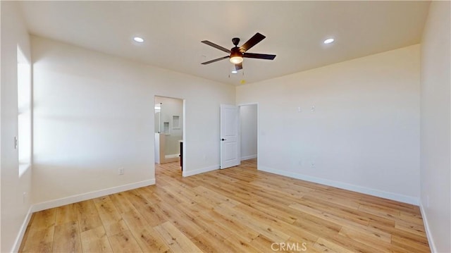 unfurnished bedroom with ceiling fan and light wood-type flooring