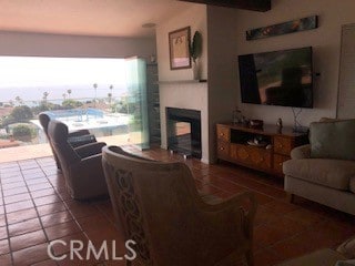 tiled living room with a multi sided fireplace