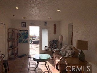 living room with tile patterned flooring